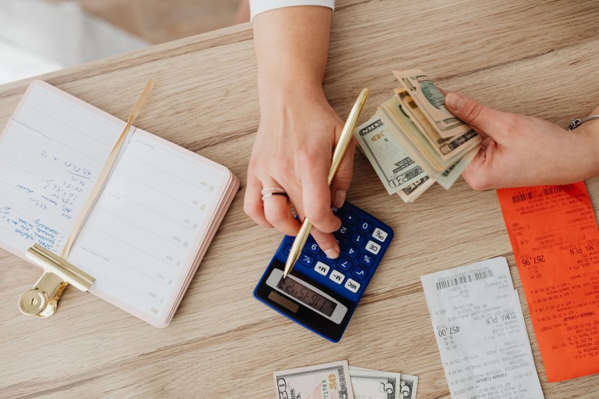 A person calculating payment